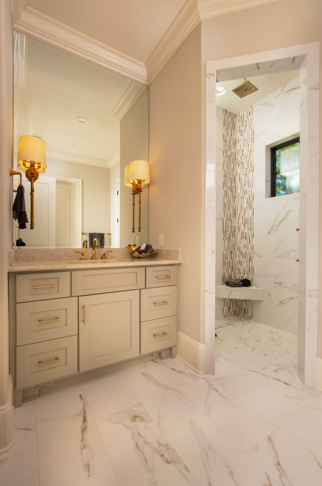 Bathroom - mid-sized transitional master beige tile and ceramic tile ceramic tile, gray floor and single-sink bathroom idea in Other with shaker cabinets, gray cabinets, a two-piece toilet, beige walls, a drop-in sink, quartzite countertops, gray countertops and a built-in vanity