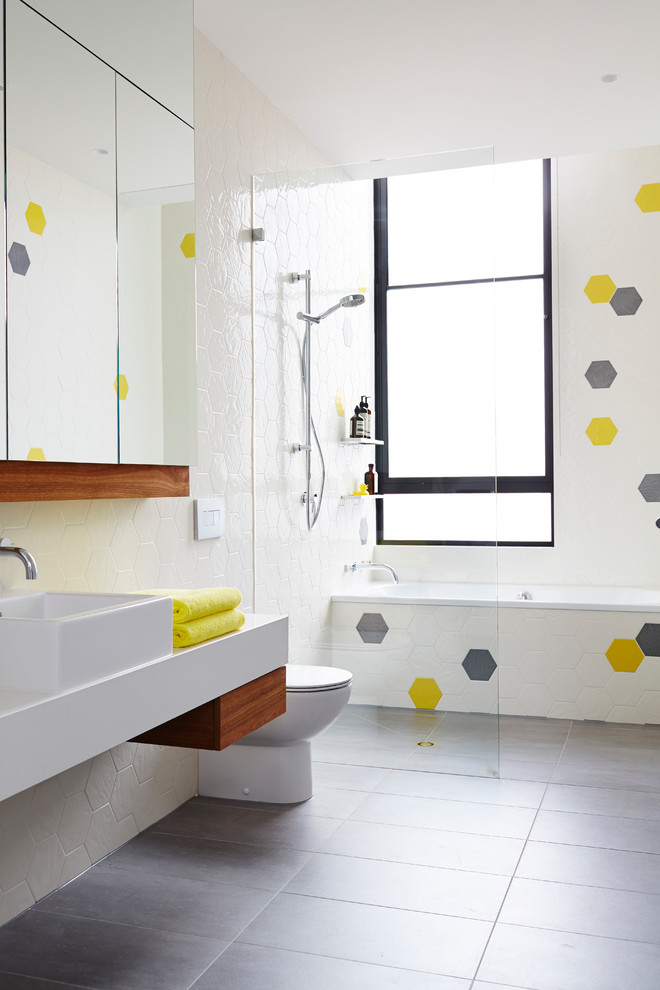 Mid-sized danish kids' ceramic tile and multicolored tile porcelain tile bathroom photo in Melbourne with a vessel sink, white walls, quartz countertops and a one-piece toilet