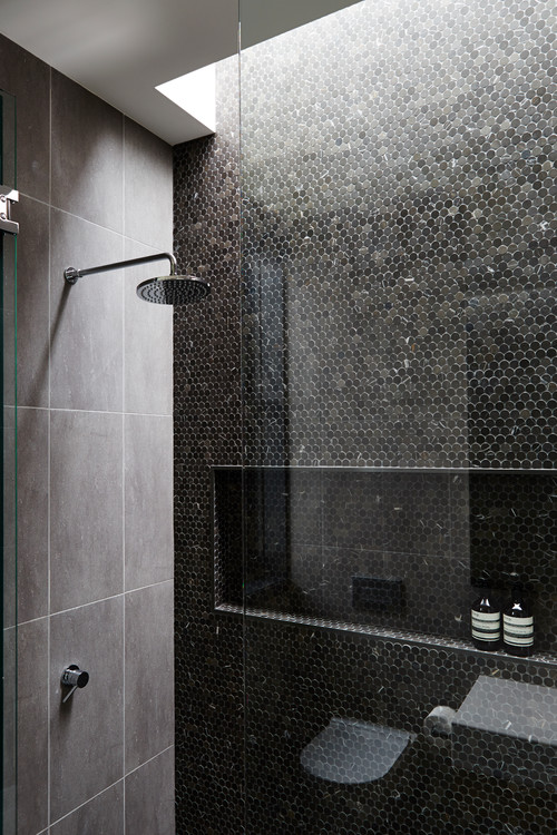 Modern Elegance: Black Marble Penny Tile Shower with Built-in Niche