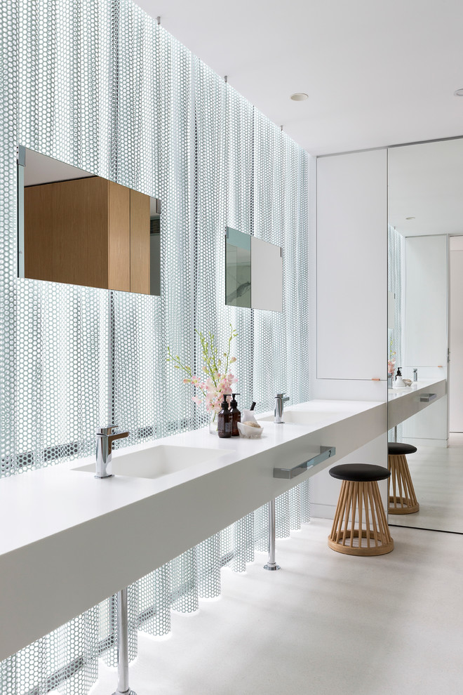 This is an example of a contemporary bathroom in Melbourne with white walls and an integrated sink.