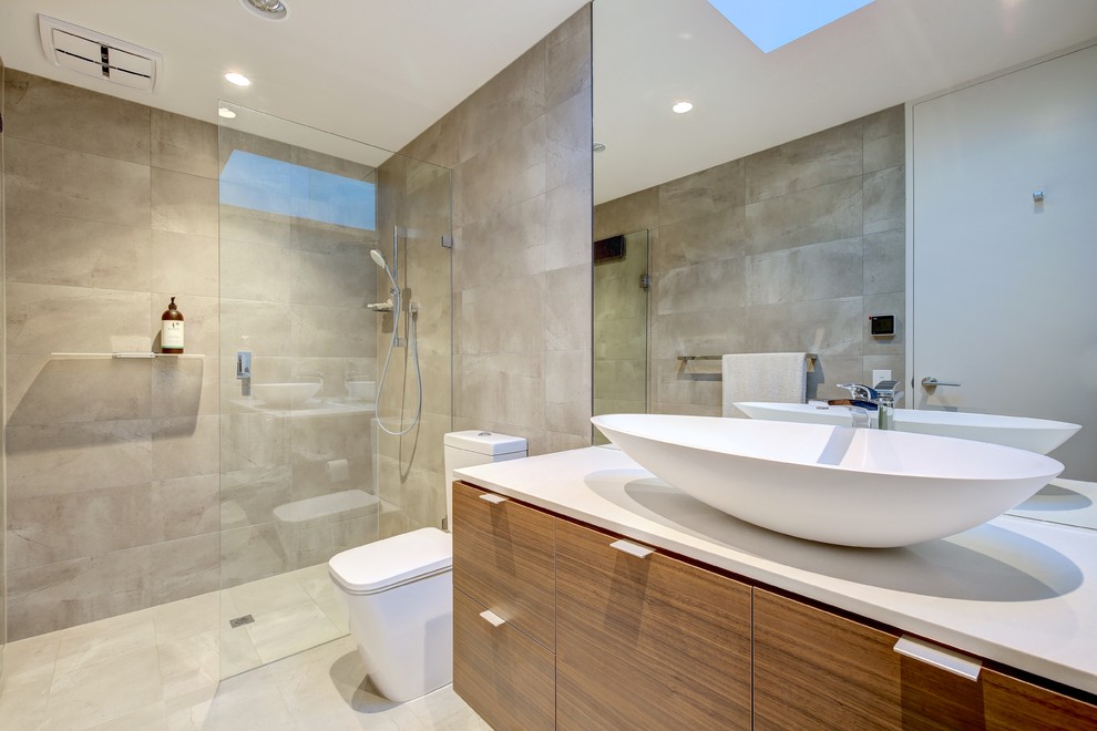 Inspiration for a large contemporary 3/4 gray tile and porcelain tile porcelain tile and beige floor bathroom remodel in Adelaide with flat-panel cabinets, medium tone wood cabinets, a one-piece toilet, multicolored walls, a vessel sink, quartz countertops and white countertops