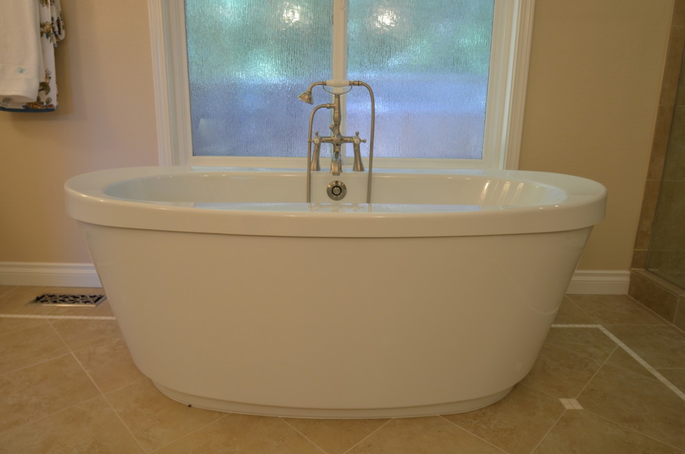 Freestanding bathtub - traditional master freestanding bathtub idea in San Francisco with recessed-panel cabinets, white cabinets and beige walls