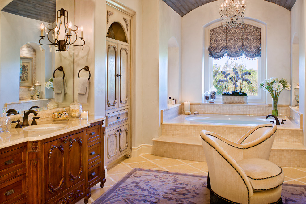 Elegant bathroom photo in Austin with marble countertops