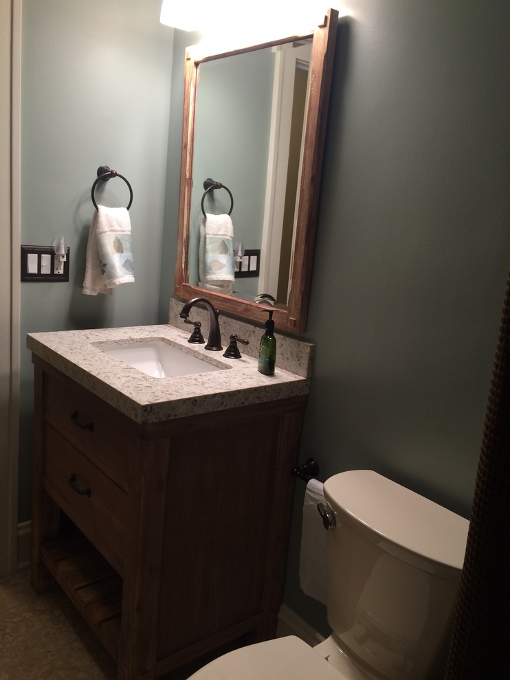 Example of a small farmhouse kids' white tile and subway tile laminate floor bathroom design in Cleveland with open cabinets, light wood cabinets, a two-piece toilet, blue walls, an undermount sink and quartzite countertops