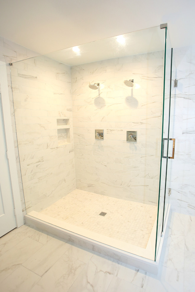 Bathroom - mid-sized transitional master gray tile and marble tile marble floor and gray floor bathroom idea in Dallas with recessed-panel cabinets, white cabinets, a one-piece toilet, gray walls, a drop-in sink, quartz countertops and a hinged shower door