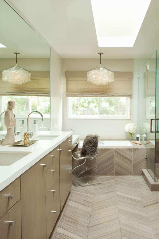 Photo of a medium sized modern ensuite bathroom in Los Angeles with flat-panel cabinets, beige cabinets, a built-in bath, a corner shower, a two-piece toilet, beige tiles, brown tiles, white walls, porcelain flooring, a submerged sink, engineered stone worktops, porcelain tiles, beige floors and a hinged door.