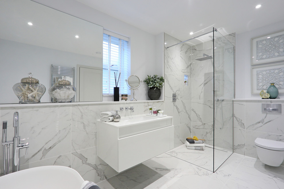 Example of a mid-sized trendy kids' white tile and porcelain tile porcelain tile and white floor bathroom design in Surrey with a one-piece toilet and white walls