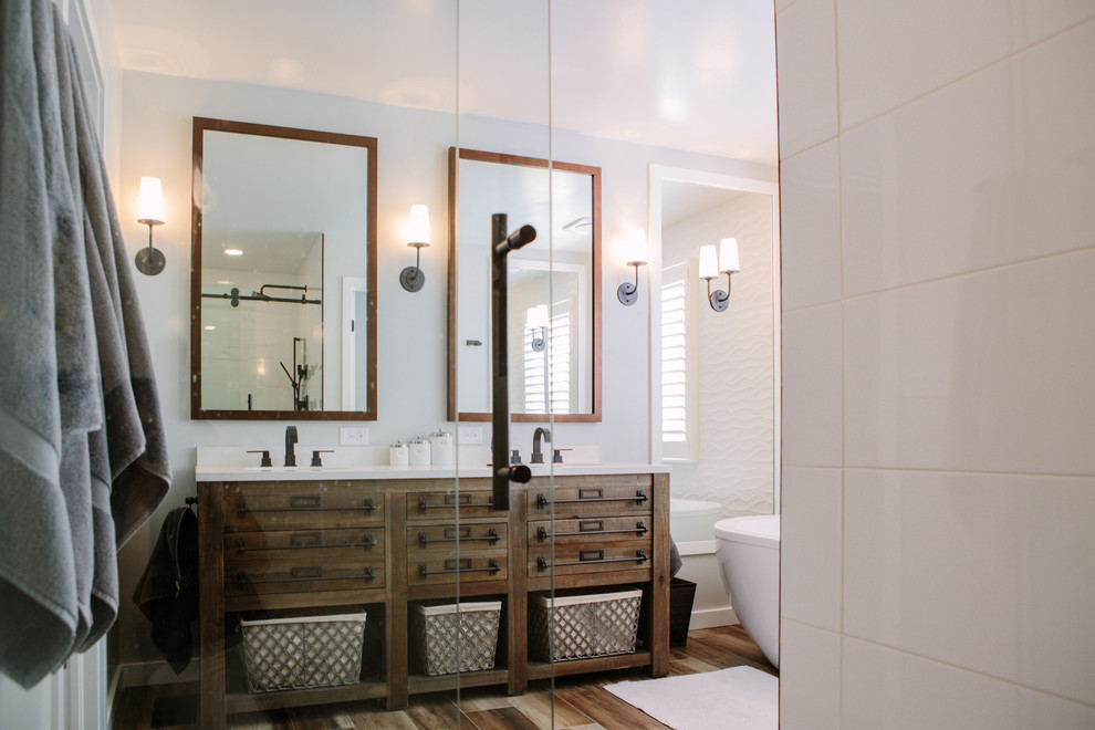 Example of a mid-sized cottage master white tile and ceramic tile porcelain tile and brown floor bathroom design in Denver with furniture-like cabinets, distressed cabinets, a one-piece toilet, gray walls, an undermount sink and quartz countertops