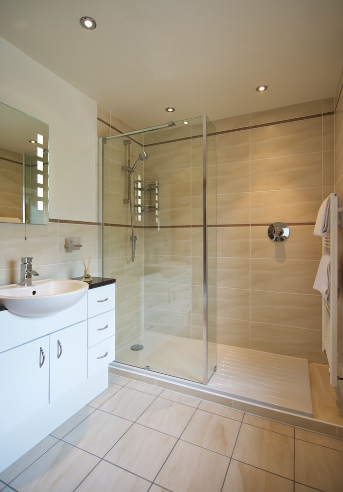 Inspiration for a medium sized contemporary ensuite bathroom in Other with a built-in sink, a double shower, ceramic flooring, white cabinets, laminate worktops, a wall mounted toilet, beige tiles, ceramic tiles and beige walls.