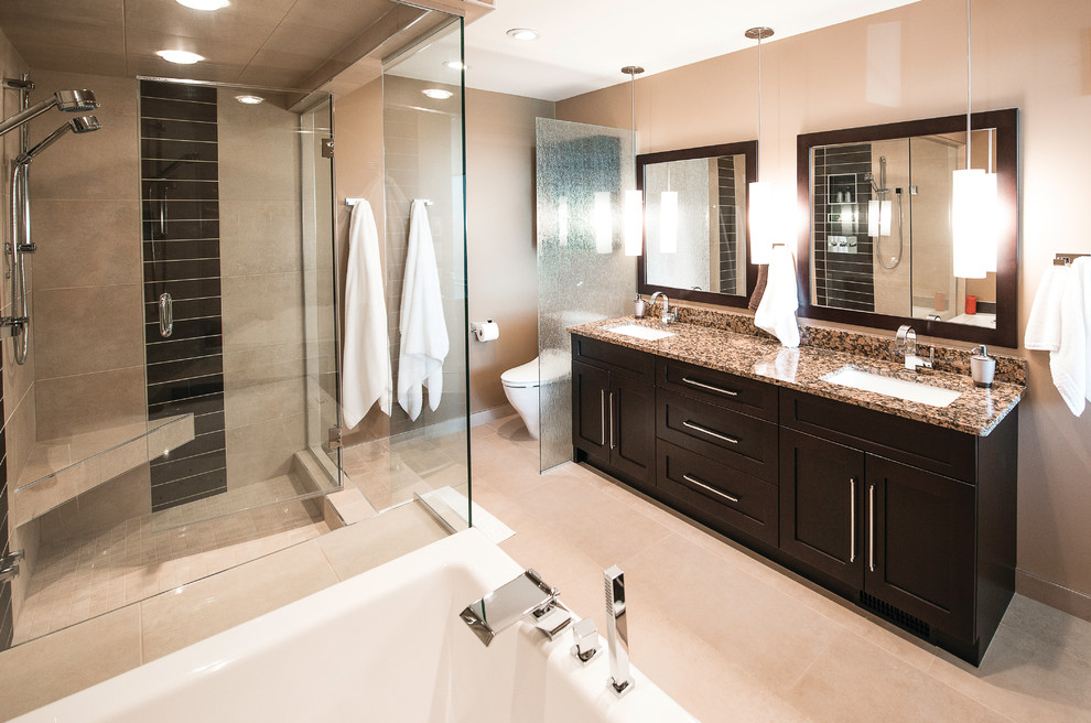 Design ideas for a medium sized contemporary ensuite bathroom in Other with shaker cabinets, brown cabinets, a built-in bath, a double shower, beige walls, porcelain flooring, granite worktops, a hinged door, a two-piece toilet, black tiles, brown tiles, a submerged sink, beige floors and brown worktops.