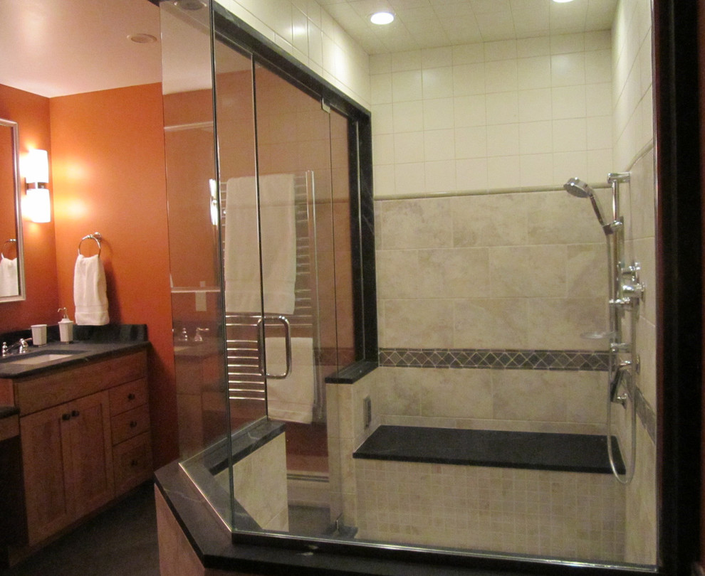 Example of a large transitional master gray tile and porcelain tile ceramic tile corner shower design in Boston with an undermount sink, shaker cabinets, light wood cabinets, soapstone countertops, a two-piece toilet and orange walls
