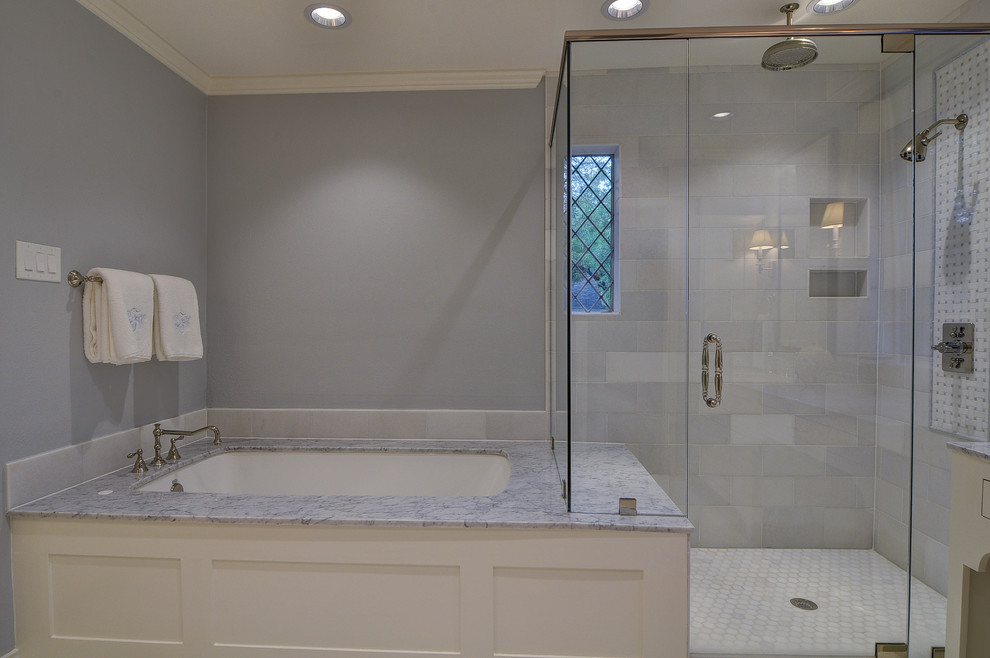 Example of a large transitional master gray tile and stone tile ceramic tile bathroom design with flat-panel cabinets, white cabinets, a two-piece toilet, gray walls, an undermount sink and quartz countertops