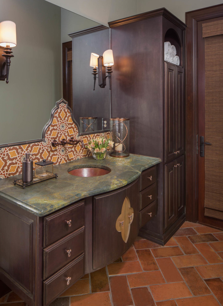 Classic sauna bathroom in Austin with a submerged sink, recessed-panel cabinets, dark wood cabinets, granite worktops, terracotta tiles, green walls, terracotta flooring and a two-piece toilet.