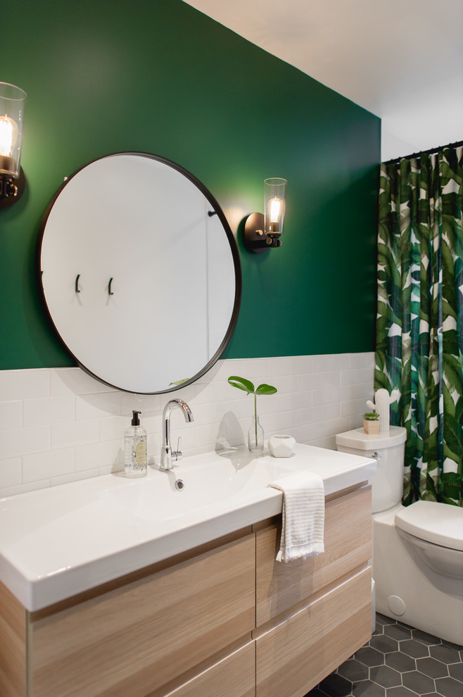 Bathroom - coastal 3/4 white tile and subway tile gray floor and ceramic tile bathroom idea in Montreal with flat-panel cabinets, light wood cabinets, a one-piece toilet, green walls, a console sink, quartzite countertops and white countertops