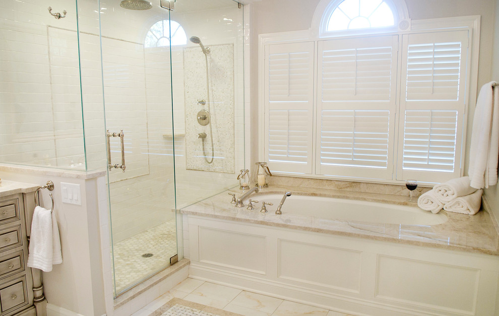 Example of a large classic master white tile and marble tile marble floor and beige floor corner shower design in New York with beaded inset cabinets, beige cabinets, an undermount tub, a two-piece toilet, beige walls, an undermount sink, quartzite countertops and a hinged shower door