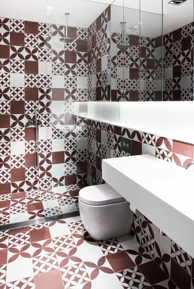 Inspiration for a medium sized contemporary family bathroom in Sydney with flat-panel cabinets, a built-in shower, a one-piece toilet, red tiles, white tiles, white walls, ceramic flooring, a wall-mounted sink, porcelain tiles, engineered stone worktops, orange floors and an open shower.
