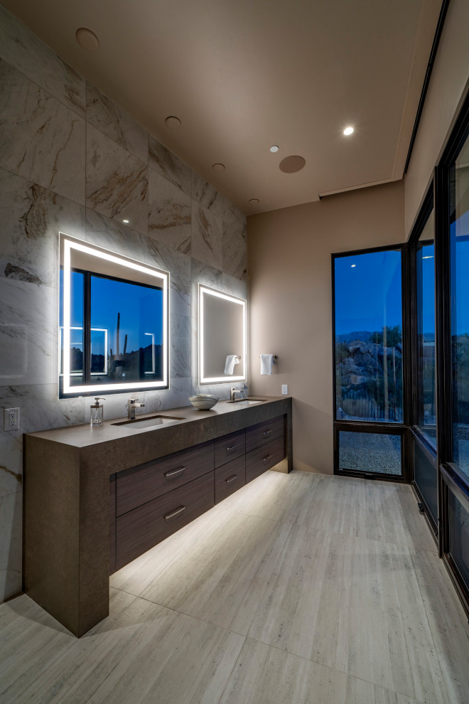 This is an example of a large contemporary ensuite bathroom in Phoenix with flat-panel cabinets, medium wood cabinets, brown tiles, grey tiles, grey walls, a submerged sink, beige floors, brown worktops, double sinks and a built in vanity unit.