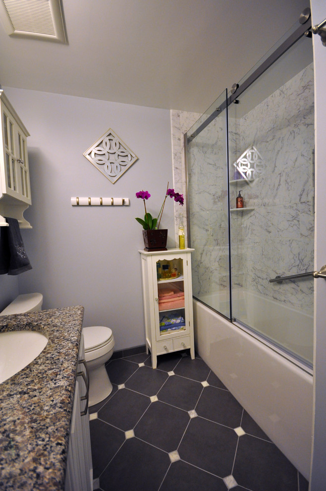 Example of a mid-sized asian master white tile and stone tile ceramic tile bathroom design in DC Metro with white cabinets, a two-piece toilet, an undermount sink, granite countertops, louvered cabinets and purple walls