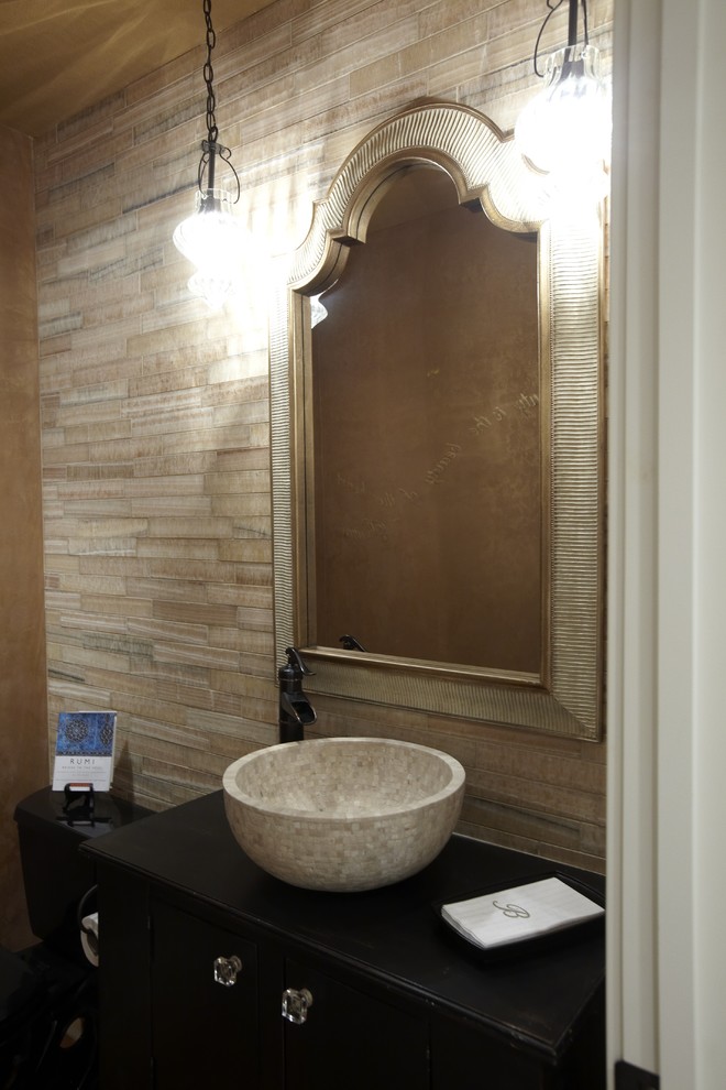 Inspiration for a timeless stone tile bathroom remodel in Tampa with a vessel sink