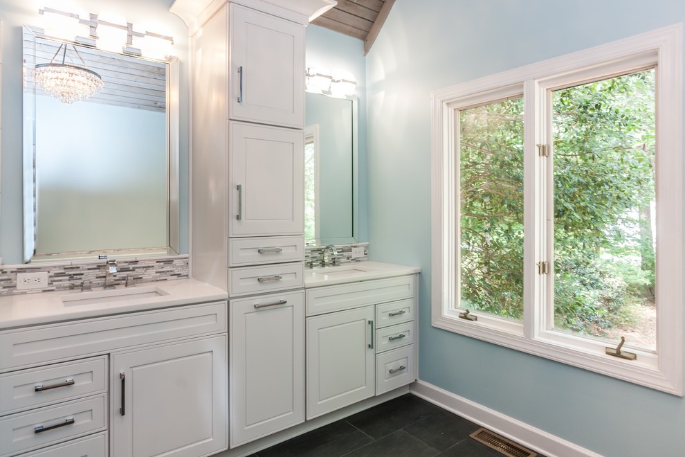 Large contemporary ensuite bathroom in Raleigh with shaker cabinets, white cabinets, a built-in bath, a corner shower, a two-piece toilet, white tiles, ceramic tiles, blue walls, ceramic flooring, a submerged sink and quartz worktops.