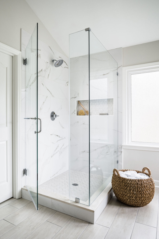 Large elegant master white tile and porcelain tile porcelain tile and beige floor corner shower photo in Charlotte with shaker cabinets, gray cabinets, a two-piece toilet, white walls, an undermount sink, marble countertops, a hinged shower door and gray countertops