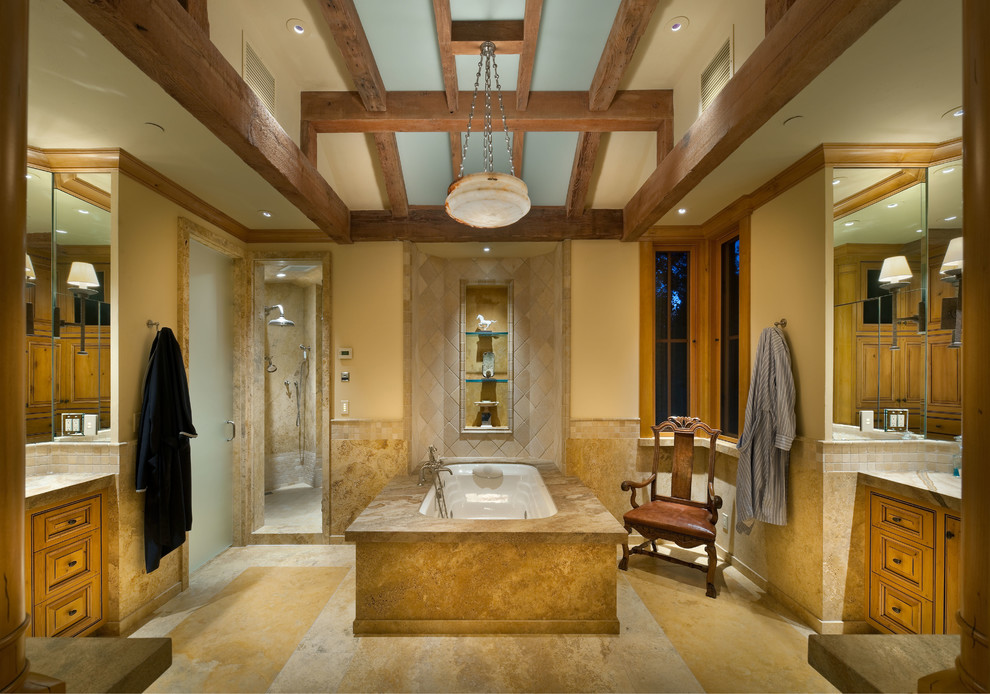Double shower - huge traditional master beige tile and mosaic tile limestone floor double shower idea in Other with a drop-in sink, beaded inset cabinets, light wood cabinets, marble countertops, an undermount tub, a one-piece toilet and beige walls