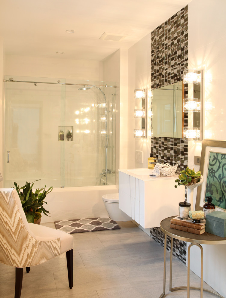 This is an example of an expansive contemporary bathroom in Other with an integrated sink, a walk-in shower, a wall mounted toilet, white tiles, stone slabs, medium hardwood flooring, flat-panel cabinets, white cabinets, a built-in bath, white walls and a sliding door.