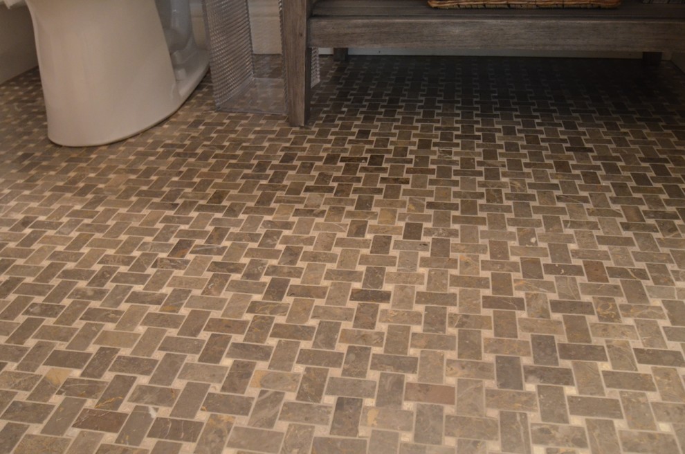 Example of a mid-sized classic 3/4 brown tile, gray tile and stone tile porcelain tile bathroom design in San Francisco with flat-panel cabinets, distressed cabinets, a one-piece toilet, gray walls, a vessel sink and concrete countertops