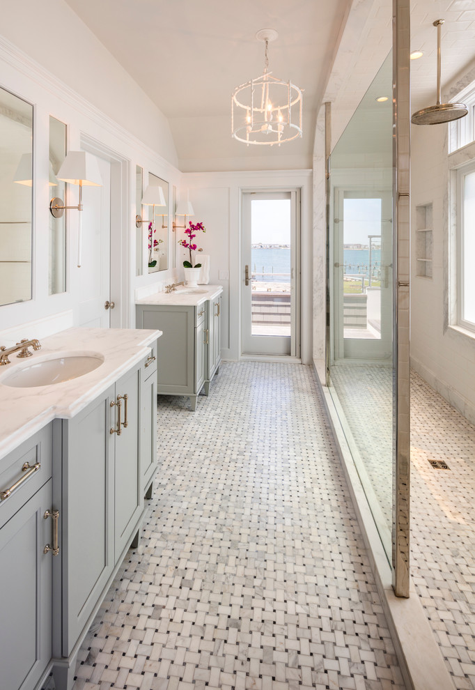 This is an example of a large traditional ensuite bathroom in New York with shaker cabinets, grey cabinets, a walk-in shower, white tiles, white walls, ceramic flooring, a submerged sink, marble worktops, white floors and an open shower.
