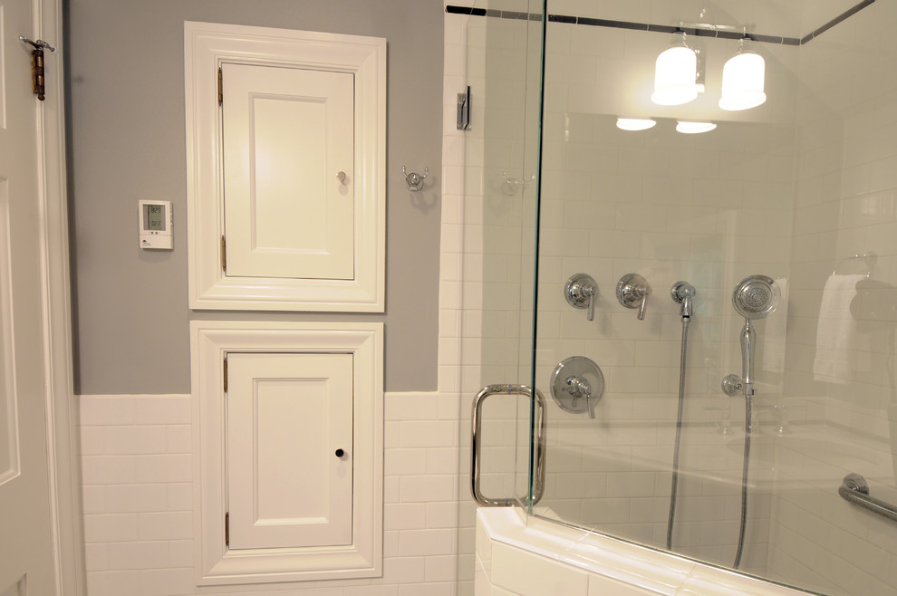 Small classic shower room bathroom in Other with recessed-panel cabinets, a corner shower, a two-piece toilet, grey walls, marble flooring, a submerged sink, engineered stone worktops, white cabinets, white tiles and porcelain tiles.