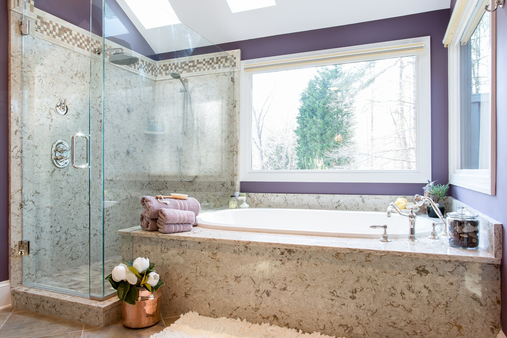 Drop-in bathtub - mid-sized traditional beige tile and porcelain tile porcelain tile drop-in bathtub idea in Raleigh with an undermount sink, raised-panel cabinets, medium tone wood cabinets, quartzite countertops and purple walls