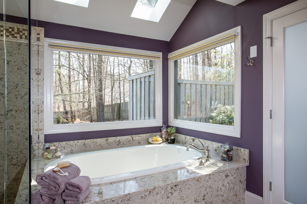Inspiration for a medium sized classic bathroom in Raleigh with a submerged sink, raised-panel cabinets, medium wood cabinets, quartz worktops, a built-in bath, beige tiles, porcelain tiles, purple walls and porcelain flooring.