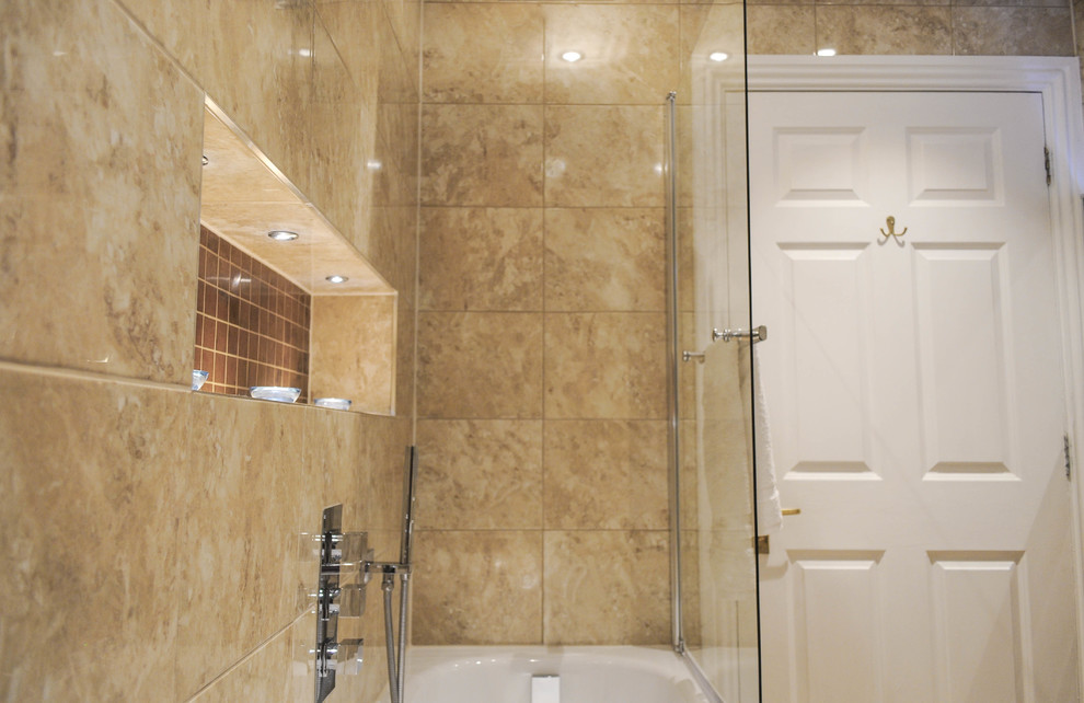 Contemporary family bathroom in London with beige tiles.
