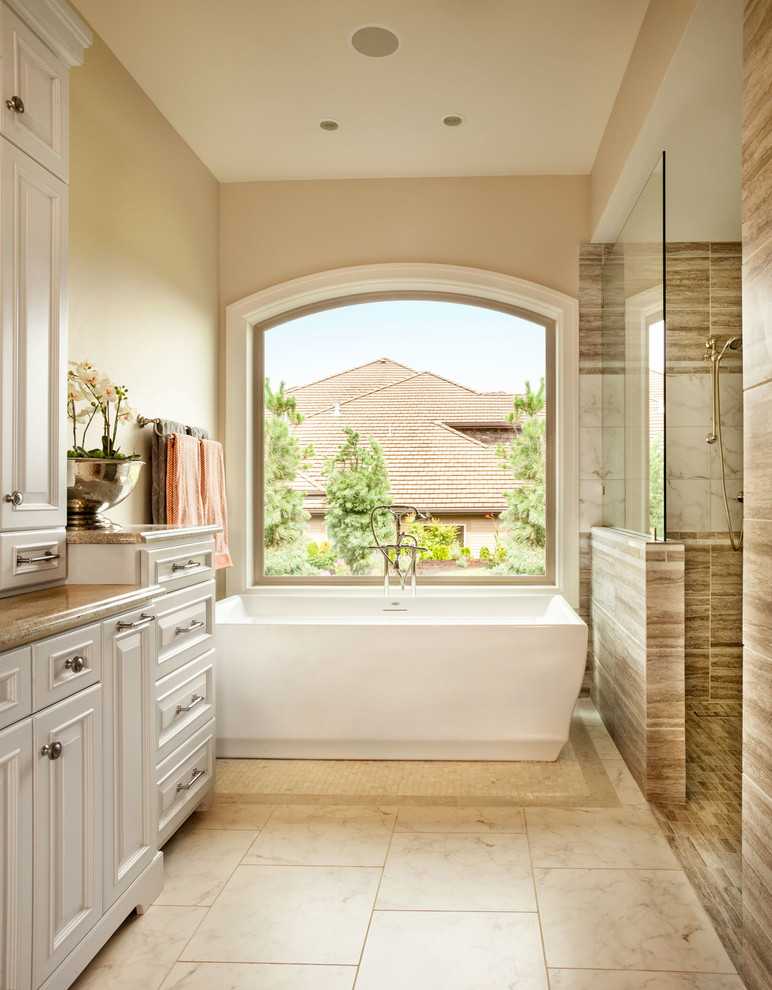 Mid-sized elegant master brown tile and porcelain tile porcelain tile bathroom photo in Portland with an integrated sink, shaker cabinets, white cabinets, granite countertops, a one-piece toilet and beige walls
