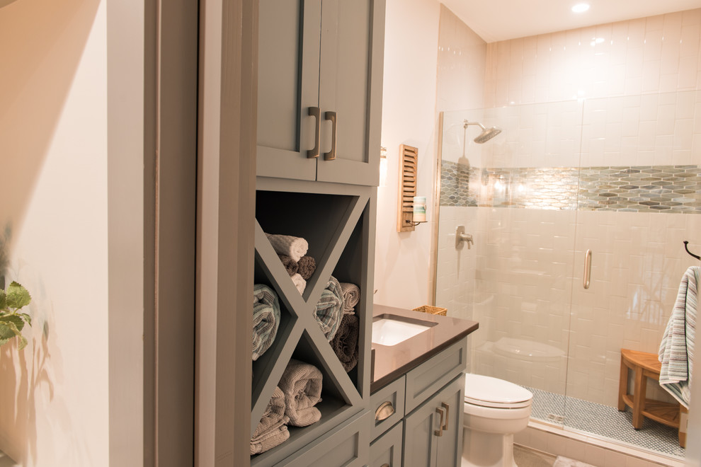 Medium sized traditional bathroom in Charleston with shaker cabinets, grey cabinets, an alcove shower, a two-piece toilet, beige tiles, ceramic tiles, beige walls, a submerged sink, engineered stone worktops, a hinged door and brown worktops.