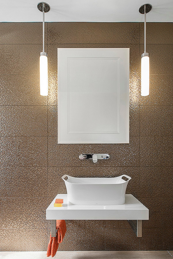 Large cottage brown tile and ceramic tile ceramic tile bathroom photo in Dublin with a trough sink, flat-panel cabinets, white cabinets, laminate countertops and brown walls