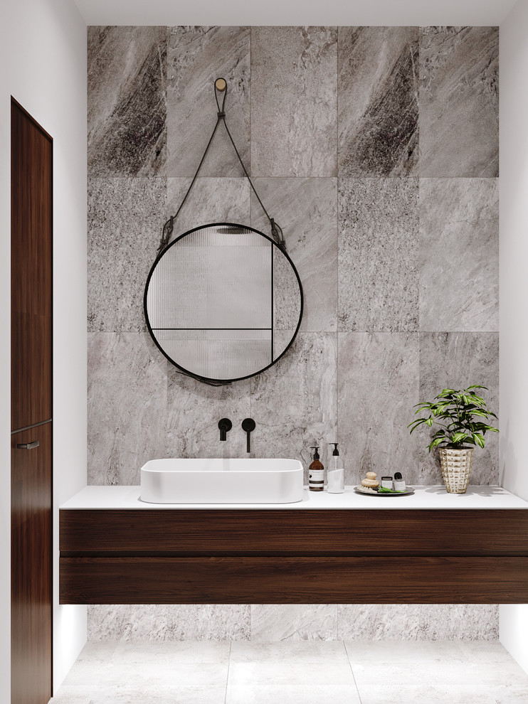 Small trendy master gray tile and ceramic tile ceramic tile and gray floor alcove shower photo in Frankfurt with flat-panel cabinets, medium tone wood cabinets, a wall-mount toilet, gray walls, a console sink, concrete countertops, a hinged shower door and white countertops
