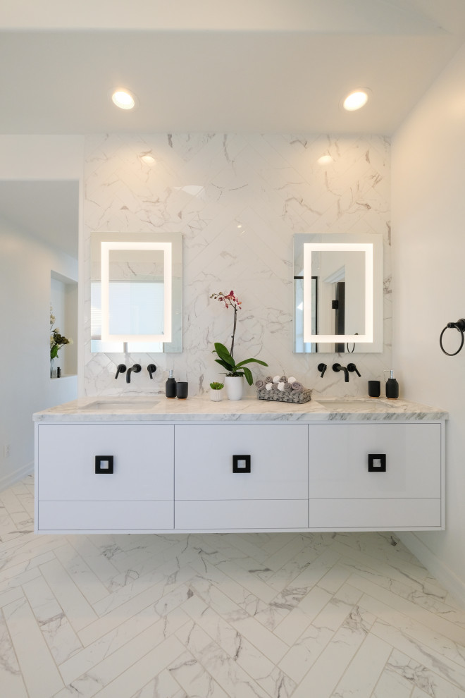 Large contemporary ensuite bathroom in San Diego with flat-panel cabinets, white cabinets, a freestanding bath, a built-in shower, a one-piece toilet, grey tiles, mosaic tiles, white walls, marble flooring, a submerged sink, marble worktops, multi-coloured floors, an open shower, grey worktops, double sinks and a built in vanity unit.