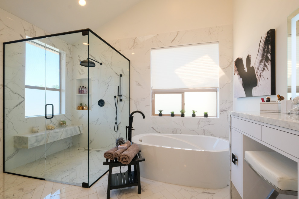 Photo of a large contemporary ensuite bathroom in San Diego with flat-panel cabinets, white cabinets, a freestanding bath, a built-in shower, a one-piece toilet, grey tiles, mosaic tiles, white walls, marble flooring, a submerged sink, marble worktops, multi-coloured floors, an open shower, grey worktops, double sinks and a built in vanity unit.