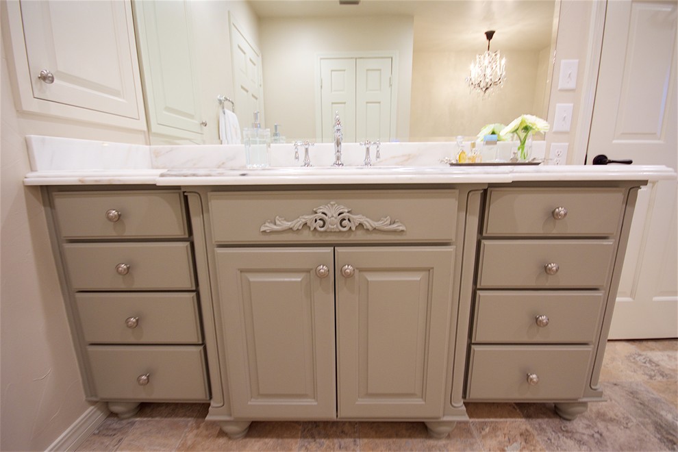Inspiration for a large contemporary master beige tile and travertine tile travertine floor and beige floor bathroom remodel in Austin with shaker cabinets, green cabinets, a two-piece toilet, beige walls, an undermount sink, marble countertops and a hinged shower door