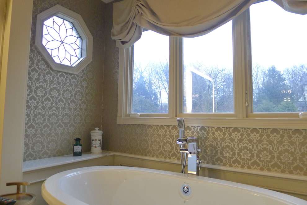 Example of a transitional beige tile and porcelain tile bathroom design in Indianapolis with a drop-in sink, marble countertops and a one-piece toilet