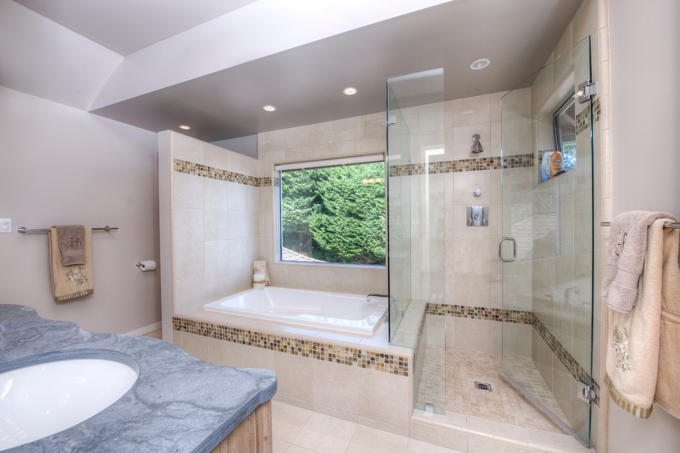 Photo of a large contemporary ensuite bathroom in San Francisco with a submerged sink, flat-panel cabinets, light wood cabinets, marble worktops, a built-in bath, a corner shower, beige tiles, beige walls and ceramic flooring.