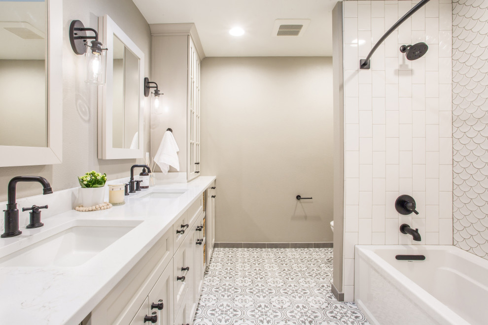 Example of a mid-sized transitional kids' white tile and porcelain tile ceramic tile and gray floor bathroom design in Seattle with shaker cabinets, white cabinets, a one-piece toilet, beige walls, an undermount sink, quartz countertops and white countertops