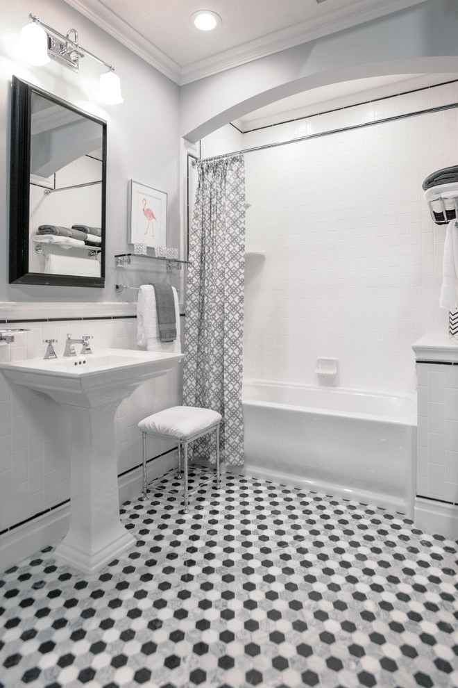 Photo of a midcentury bathroom in Minneapolis with ceramic tiles and marble flooring.
