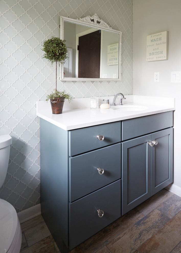 This is an example of a medium sized traditional ensuite bathroom in Jacksonville with shaker cabinets, white cabinets, a walk-in shower, a one-piece toilet, grey tiles, mosaic tiles, grey walls, marble flooring, marble worktops and a submerged sink.
