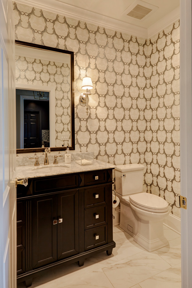 Bathroom - mid-sized transitional 3/4 white tile and porcelain tile porcelain tile and white floor bathroom idea in Jacksonville with flat-panel cabinets, black cabinets, a one-piece toilet, white walls, an undermount sink, marble countertops and a hinged shower door