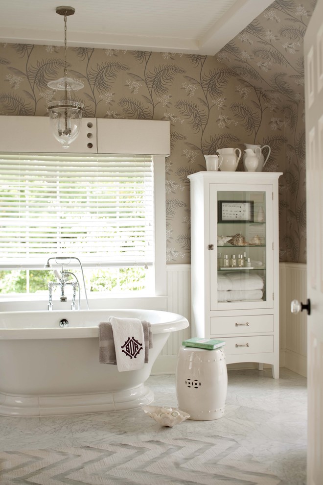 Example of a transitional freestanding bathtub design in New York