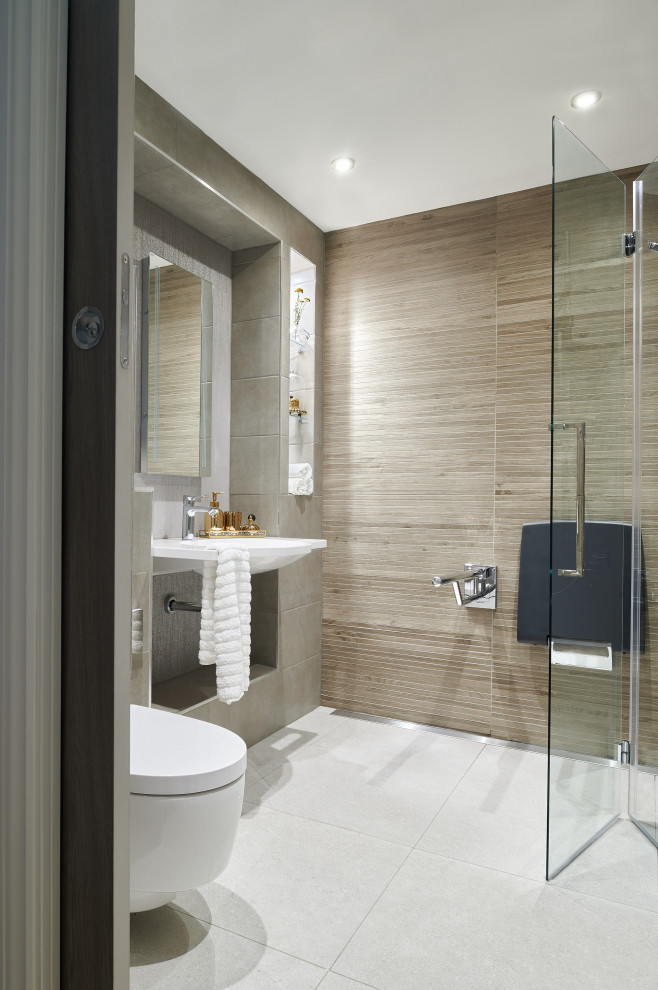 Inspiration for a medium sized modern ensuite bathroom in London with open cabinets, white cabinets, a walk-in shower, a wall mounted toilet, brown tiles, porcelain tiles, brown walls, porcelain flooring, a wall-mounted sink, white floors and a hinged door.