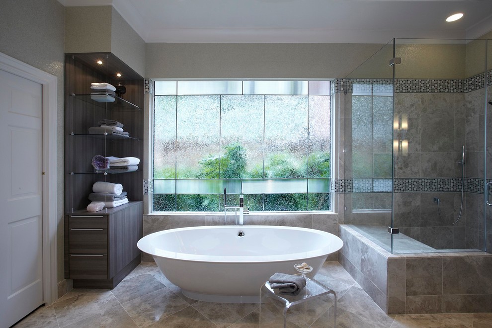 This is an example of a large contemporary ensuite bathroom in Houston with grey cabinets, a submerged sink, flat-panel cabinets, engineered stone worktops, a freestanding bath, a corner shower, multi-coloured tiles, mosaic tiles, beige walls, porcelain flooring, beige floors and a hinged door.
