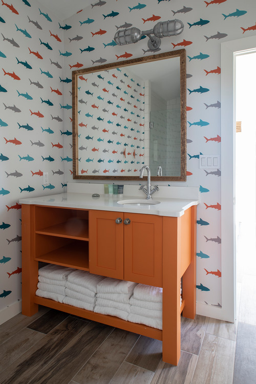 Playful Paradise: Boys Bathroom Ideas with Orange Vanity and Shark Wallpaper